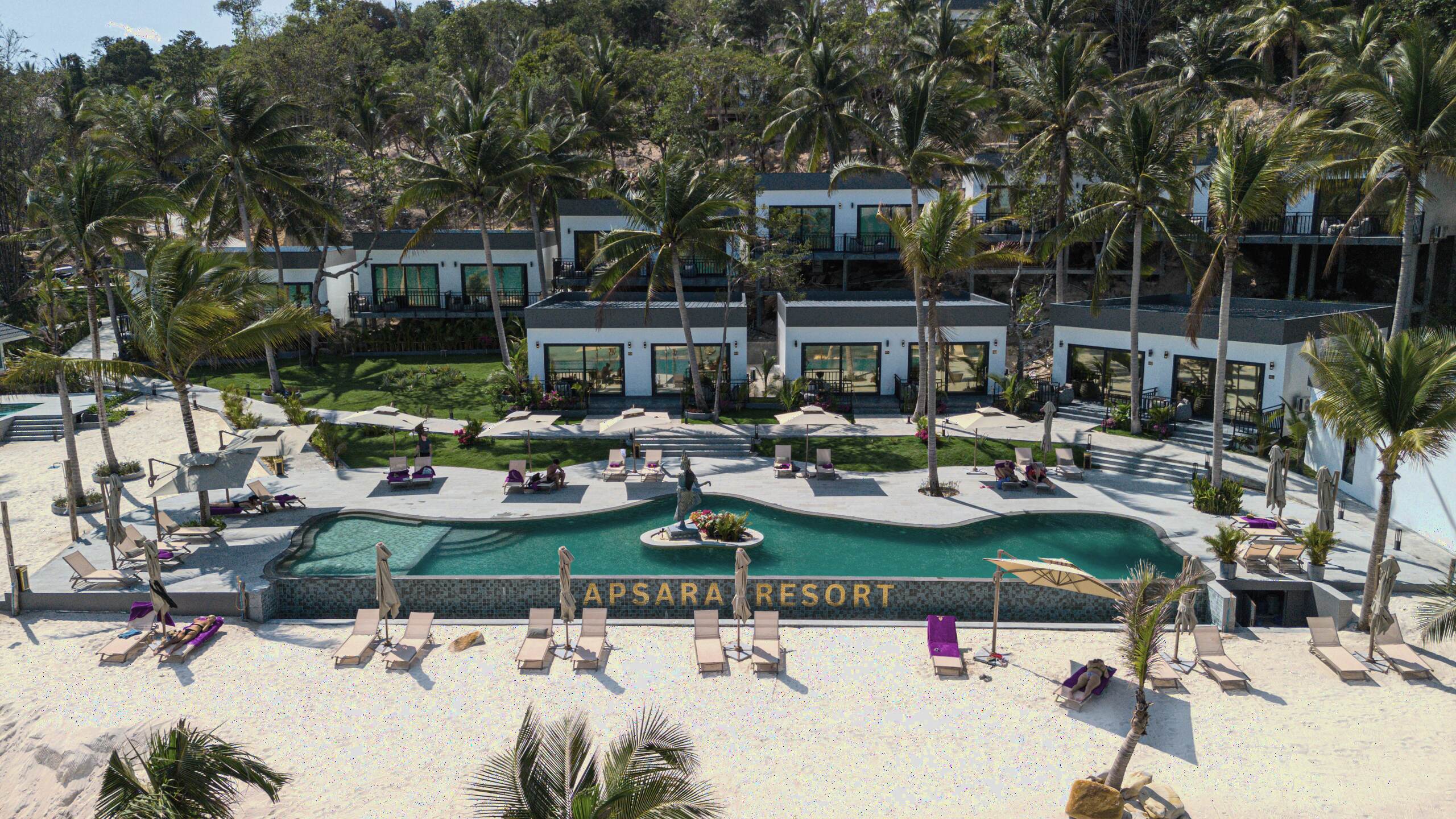 Aerial view of Apsara Resort beachfront with pool and villas