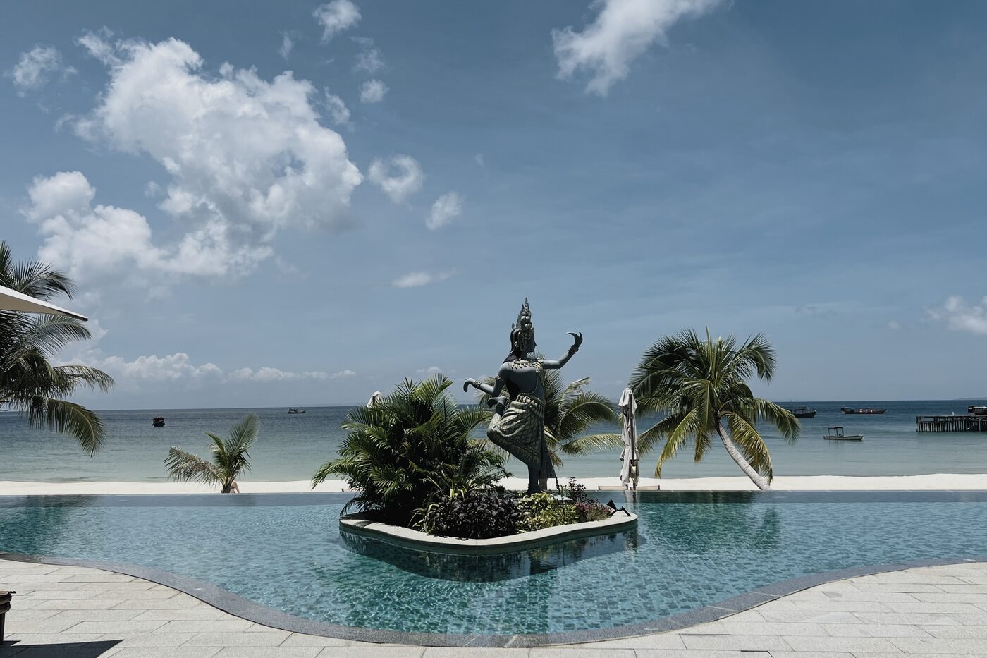 Infinity pool with Apsara statue